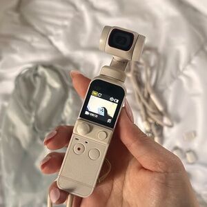 Compact Cream Handheld Camera